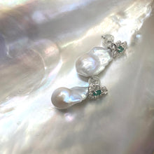 Load image into Gallery viewer, Emerald stud earrings with removable pearl drops on white pearl shell backdrop