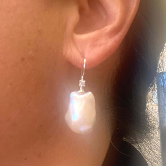 Golden Baroque Pearl Earrings – worn by female model in side view