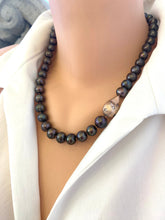 Load image into Gallery viewer, Side angle of black pearl necklace with rose gold baroque inspired pendant display