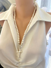 Load image into Gallery viewer, Baroque pearl cross pendant on long white pearl necklace, front view on mannequin.