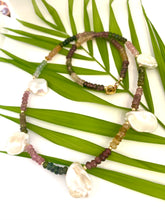 Load image into Gallery viewer, Multi tourmaline and keshi pearl necklace displayed on white and green leaf backdrop, boho-chic style.