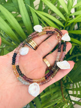 Load image into Gallery viewer, Multi tourmaline and keshi pearl necklace held in hand against green leaves, natural gemstone jewelry.