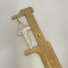 Load image into Gallery viewer, Baroque pearl cross pendant close-up beside ruler showing size and natural luster.