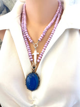 Load image into Gallery viewer, Baroque pearl cross pendant styled on different pearl necklace design, artistic jewelry display.