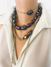 Load image into Gallery viewer, Black Baroque Pearl Necklace | Handcrafted Chunky Design showcasing unique peacock-black pearls on dark-pink silk.