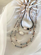 Load image into Gallery viewer, Moonstone and Baroque Pearl Necklace displayed on soft fabric with seashell decor.