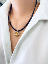 Load image into Gallery viewer, Side view of black spinel and citrine pendant necklace displayed on mannequin