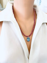 Load image into Gallery viewer, Pink Tourmaline Blue Topaz Pendant displayed on a model, showcasing handcrafted December birthstone jewelry.
