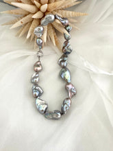Load image into Gallery viewer, Baroque pearl necklace with silver details, handmade in Canada, featuring iridescent baroque pearls in organic shapes.
