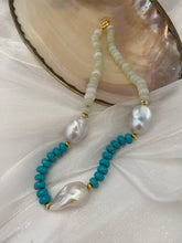 Load image into Gallery viewer, Close-up of green jade and turquoise pearl necklace on white shell backdrop