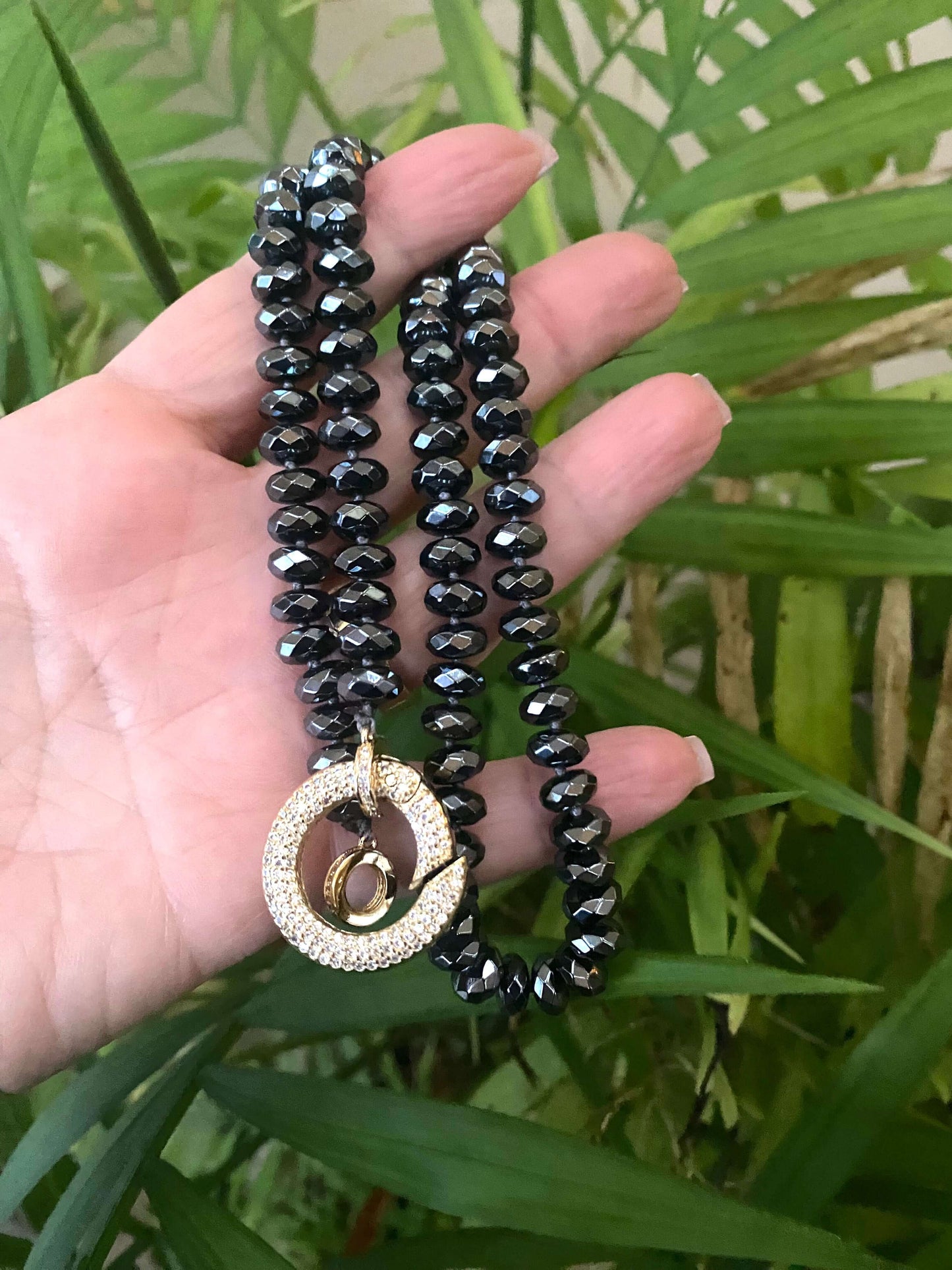 Festive Hematite Necklace featuring faceted beads and a sparkling pendant, showcasing colorful candy statement jewelry.
