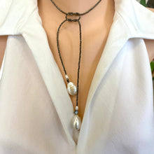 Load image into Gallery viewer, Hematite and pearl beaded lariat Y necklace featuring a single strand of tiny hematite beads, adorned with a hematite star and a baroque pearl at each end. In 27 to 32 inches, this elegant and versatile necklace adds a unique touch to any outfit.