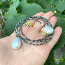 Load image into Gallery viewer, Hematite and pearl beaded lariat Y necklace featuring a single strand of tiny hematite beads, adorned with a hematite star and a baroque pearl at each end. In 27 to 32 inches, this elegant and versatile necklace adds a unique touch to any outfit.