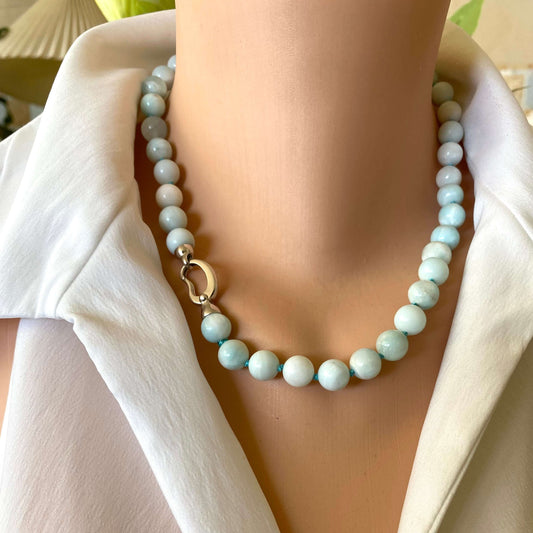 Light blue hemimorphite candy necklace worn on model sitting at the collarbone