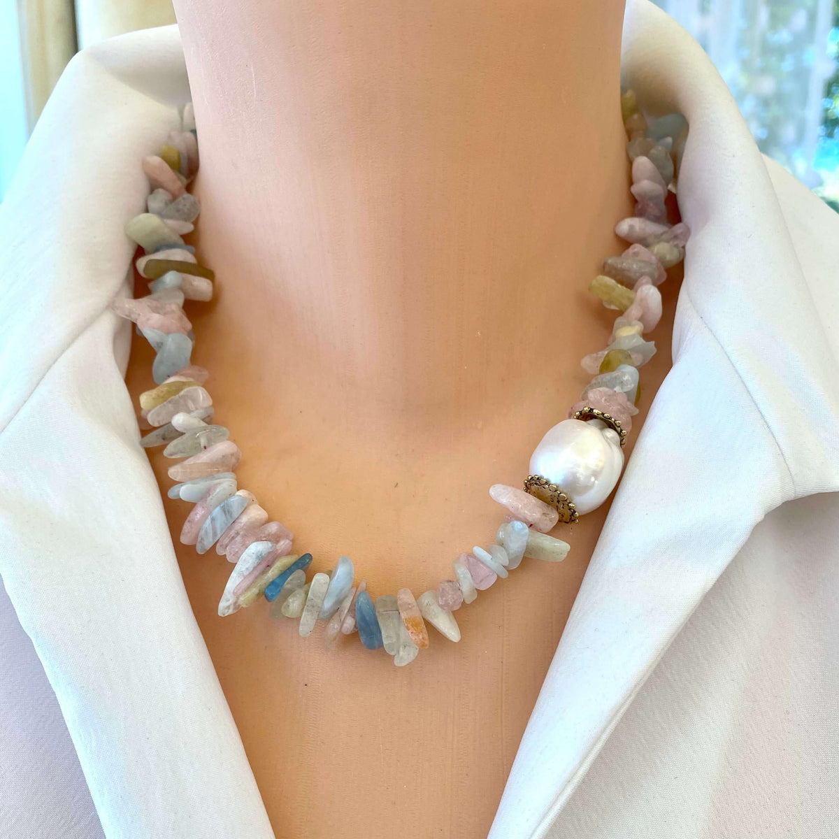 Morganite aquamarine necklace featuring pastel gemstones and a baroque pearl detail.