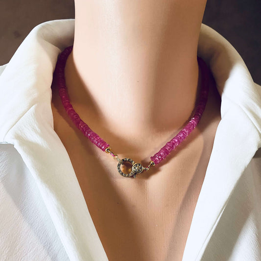 Pink topaz beaded necklace featuring gold vermeil pavé clasp, showcased on a mannequin against a white shirt.