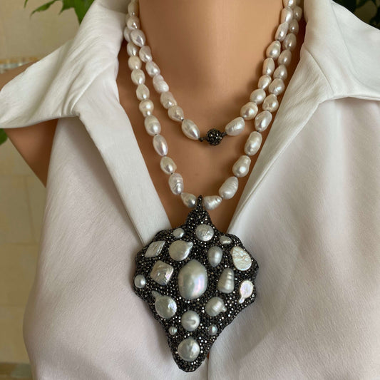 long white pearl nugget necklace with Pavé pendant worn by a mannequin, showcasing elegant freshwater pearls.