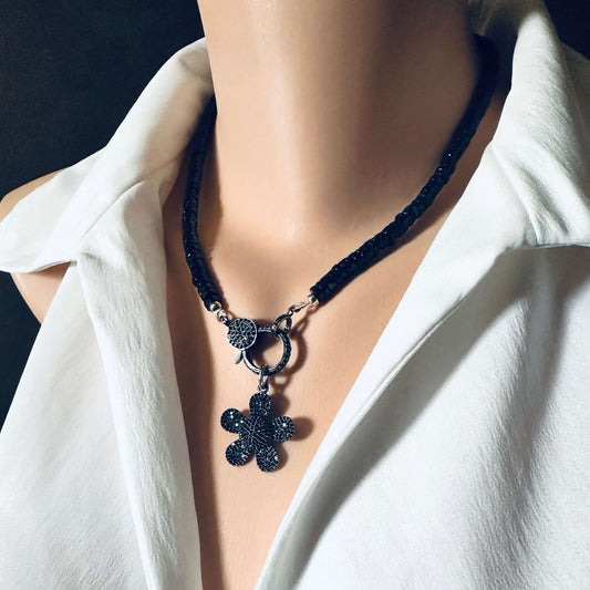 Black Spinel Daisy Pendant Necklace in Oxidized Silver – 18" showcased on a mannequin with a white blouse.
