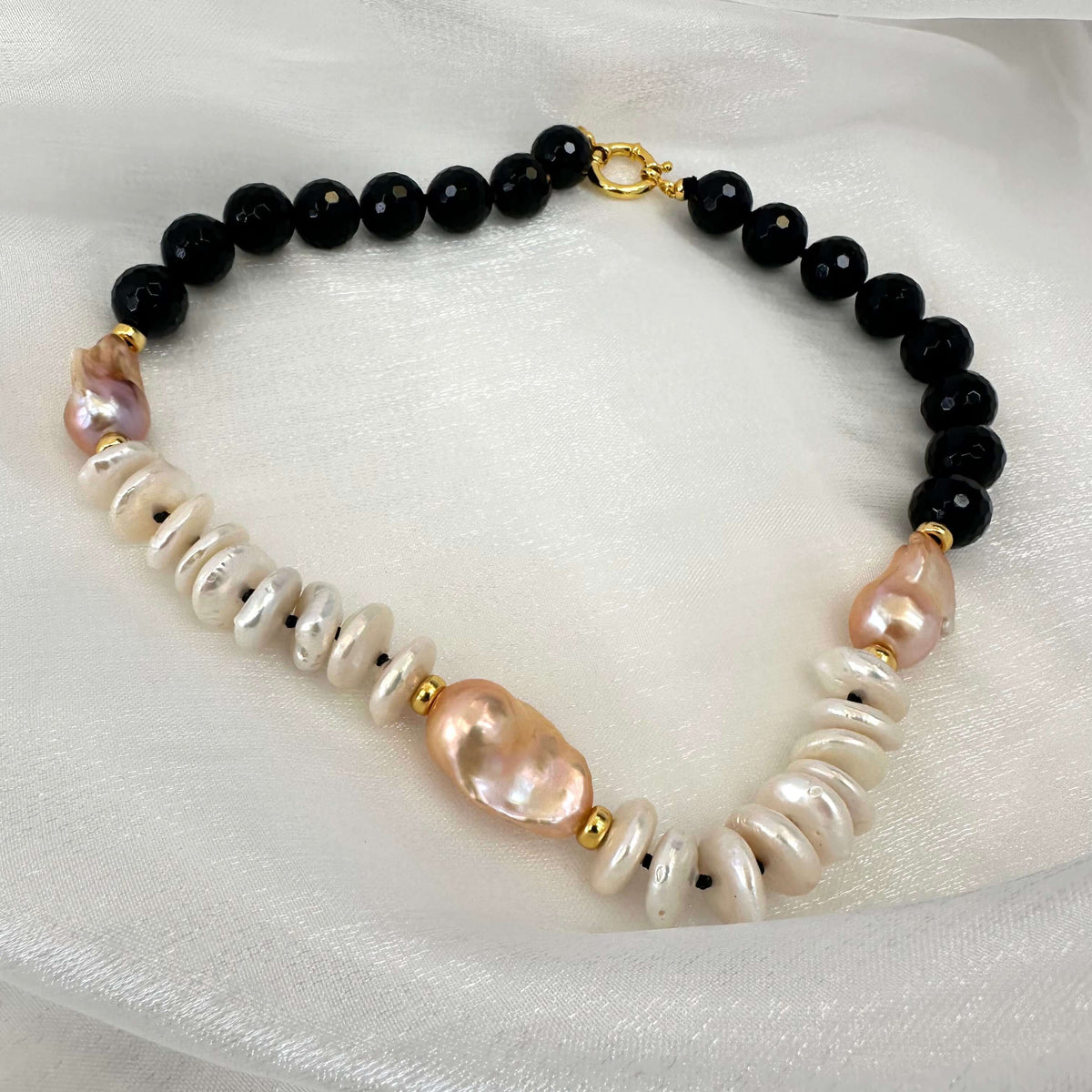 Baroque pearl necklace with black tourmaline, golden pink baroque pearls and off white coin pearls
