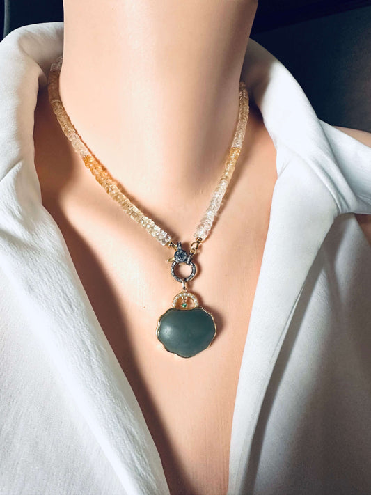 Shaded citrine gemstone necklace featuring a gold vermeil clasp and a unique pendant, enhancing any neckline.
