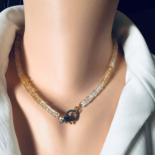 Shaded citrine gemstone necklace with diamond pavé gold vermeil clasp displayed on mannequin.