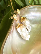 Load image into Gallery viewer, Detailed view of Baroque Pearl Gold Vermeil Earrings surrounded by pearls and green leaves — timeless handcrafted jewelry by Loulia Pearl Jewelry