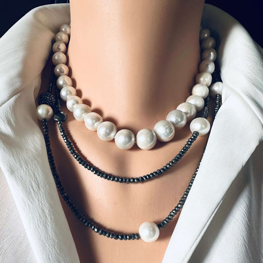 Long pyrite and pearl necklace displayed elegantly with white freshwater pearls and sparkling pyrite beads.