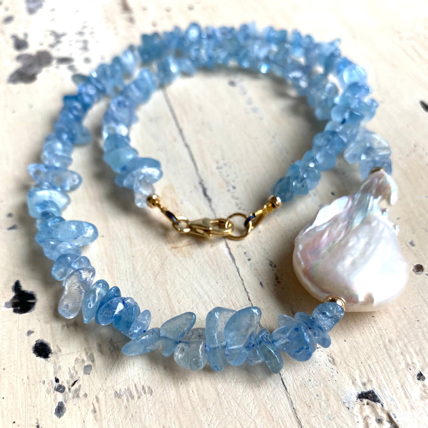 Aquamarine pearl necklace with gold filled components and flat baroque pearl accent