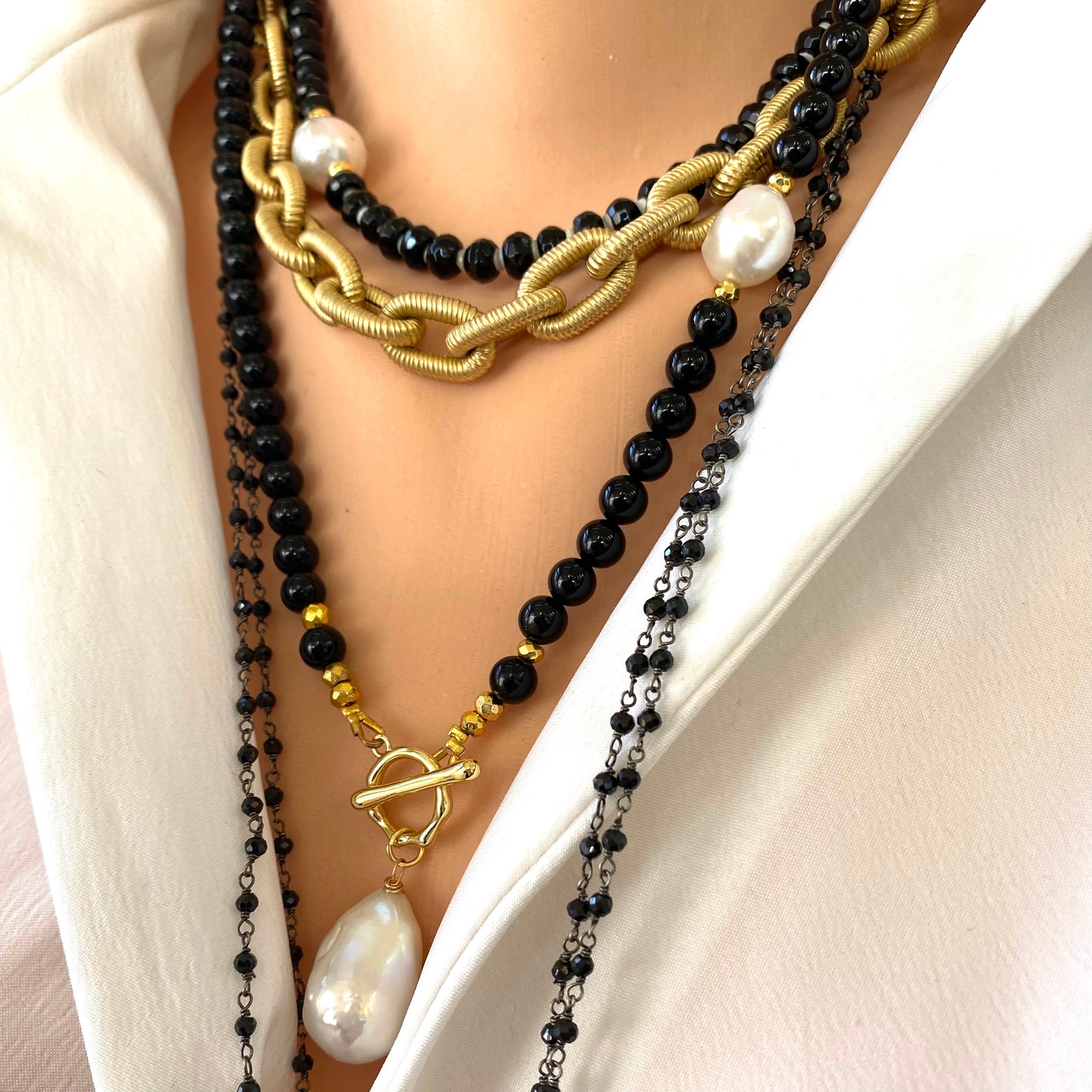 Elegant classic necklace made of black onyx beads and natural pearl. Timeless combination of black and white will suit any outfit.