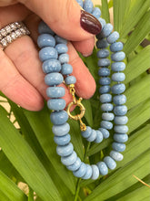 Carica l'immagine nel visualizzatore di Gallery, Graduated Oregon blue smooth opal candy necklace 8-11mm with gold vermeil plated sterling silver marine closure, measuring 18 or 19 inches. This modern opal jewelry piece features denim blue tones and is a perfect gift for her.