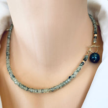 Carica l'immagine nel visualizzatore di Gallery, This necklace features a delicate chain of soft, translucent faceted green Prehnite rondelle beads, beautifully complemented by a striking Tahitian baroque pearl as the centerpiece pending from a cold filled toggle clasp. 18"inches long