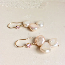 Load image into Gallery viewer, Elegant earrings composed of Natural Keshi pink and white pearls hanging from gold filled hooks with pink cubic zirconia bezel