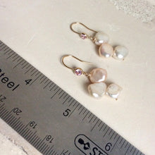 Load image into Gallery viewer, Elegant earrings composed of Natural Keshi pink and white pearls hanging from gold filled hooks with pink cubic zirconia bezel