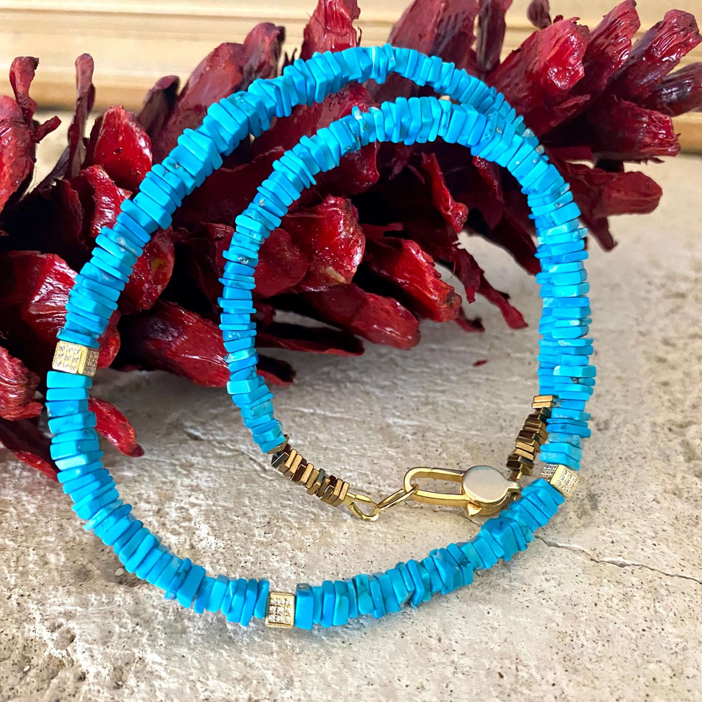 Turquoise choker necklace with natural turquoise beads, showcasing a vibrant blue color and modern elegance.
