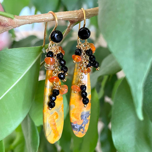 Bumble Bee Jasper earrings with carnelian and onyx clusters, featuring vibrant yellow, orange, and black stone patterns.