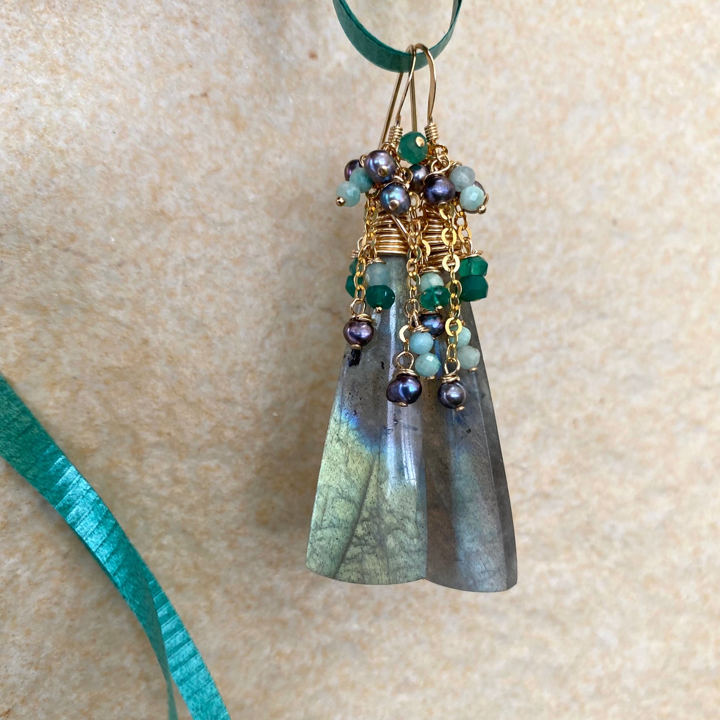 Labradorite amazonite green onyx black pearl earrings close-up showing gemstone texture and pearls