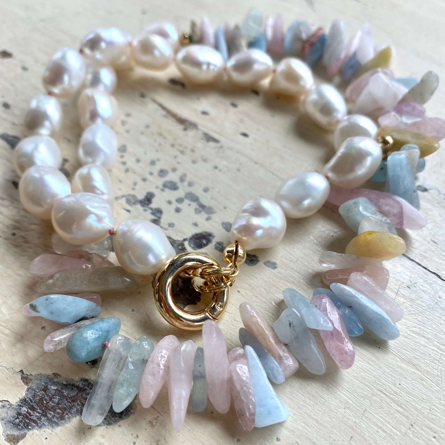 Morganite aquamarine necklace flat lay, hand-knotted pastel gemstones with removable push-lock clasp