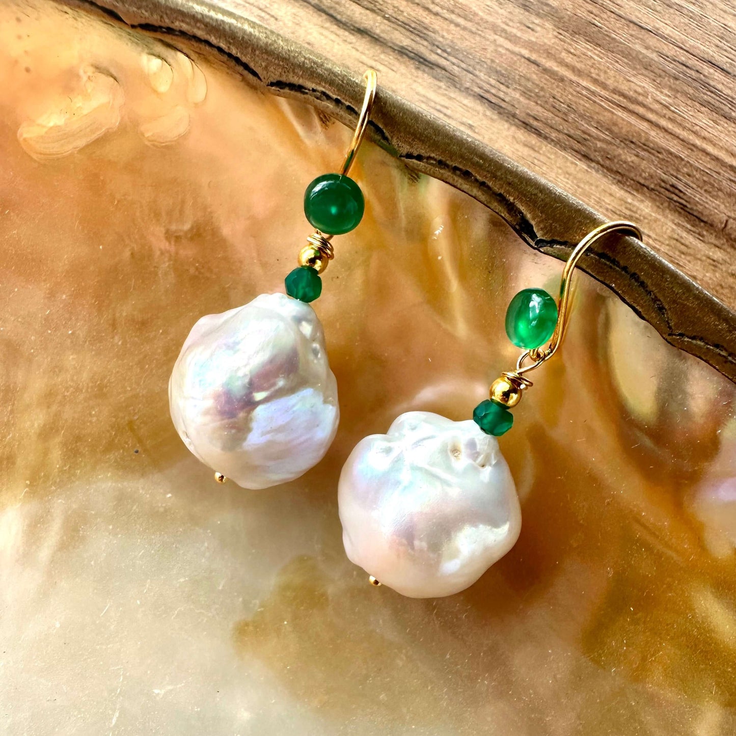 White baroque pearl drop earrings with green agate, showcasing elegant craftsmanship and natural beauty.