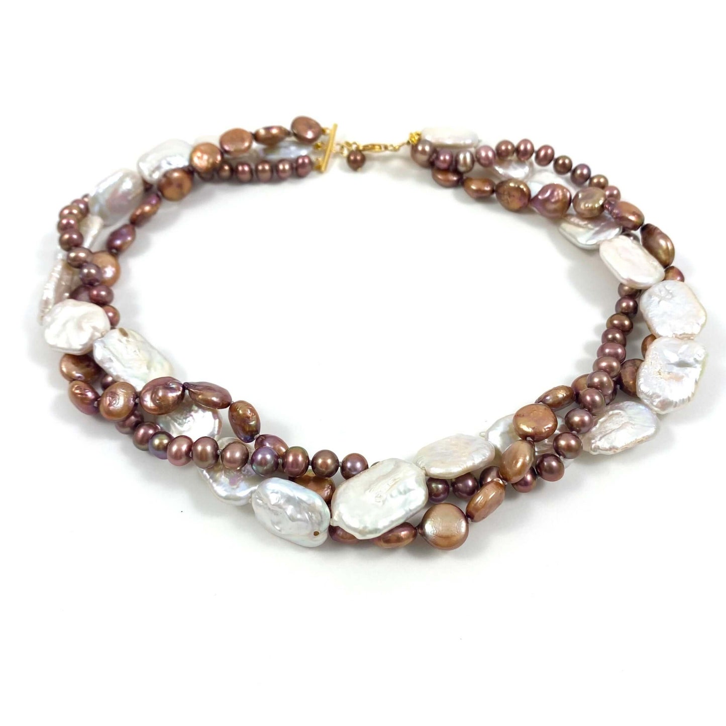 A multi-strand beaded necklace featuring brown and bronze pearls, irregular white baroque pearls, and small metallic gold beads, displayed on a clean white background.