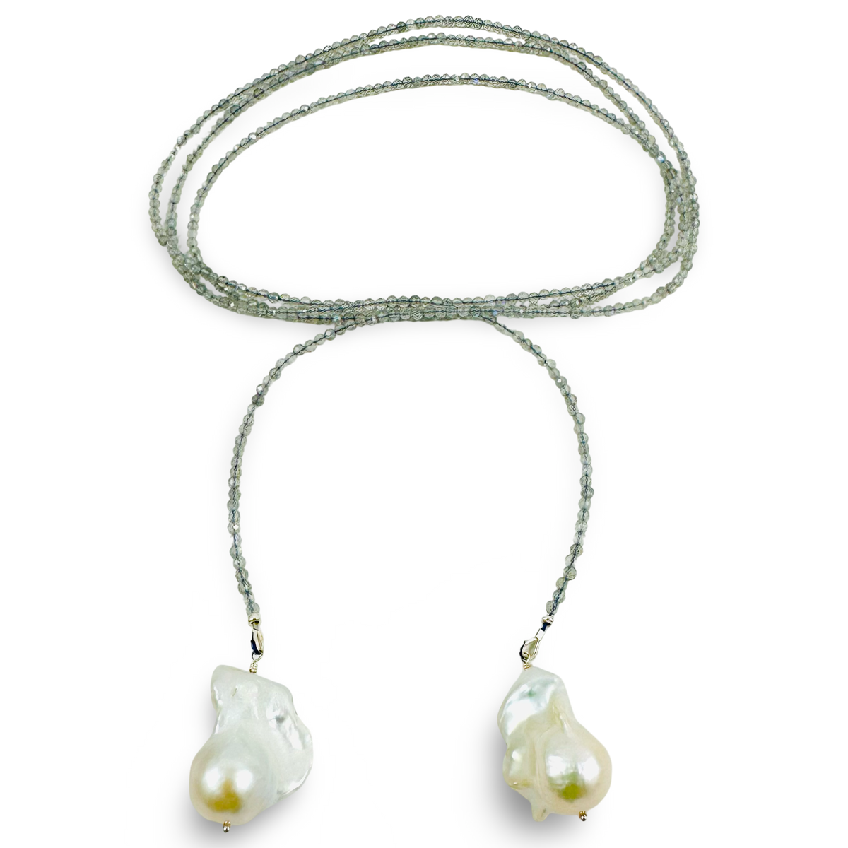 A multi-strand beaded necklace with iridescent green beads and two large, irregular baroque pearl pendants in gold-toned settings, displayed on a clean white background.