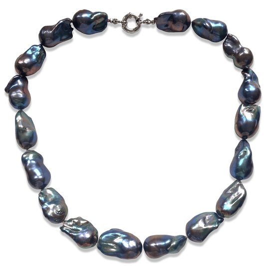 A baroque pearl necklace made of irregular, iridescent beads with a silver clasp, displayed on a plain white background.