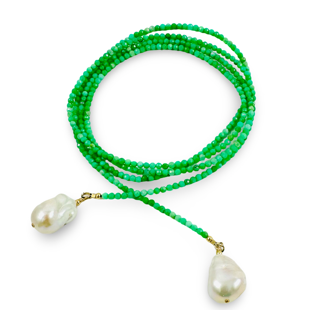 A long-strand green beaded necklace with two large, irregular white baroque pearls suspended from gold-toned clasps, displayed on a clean white background.