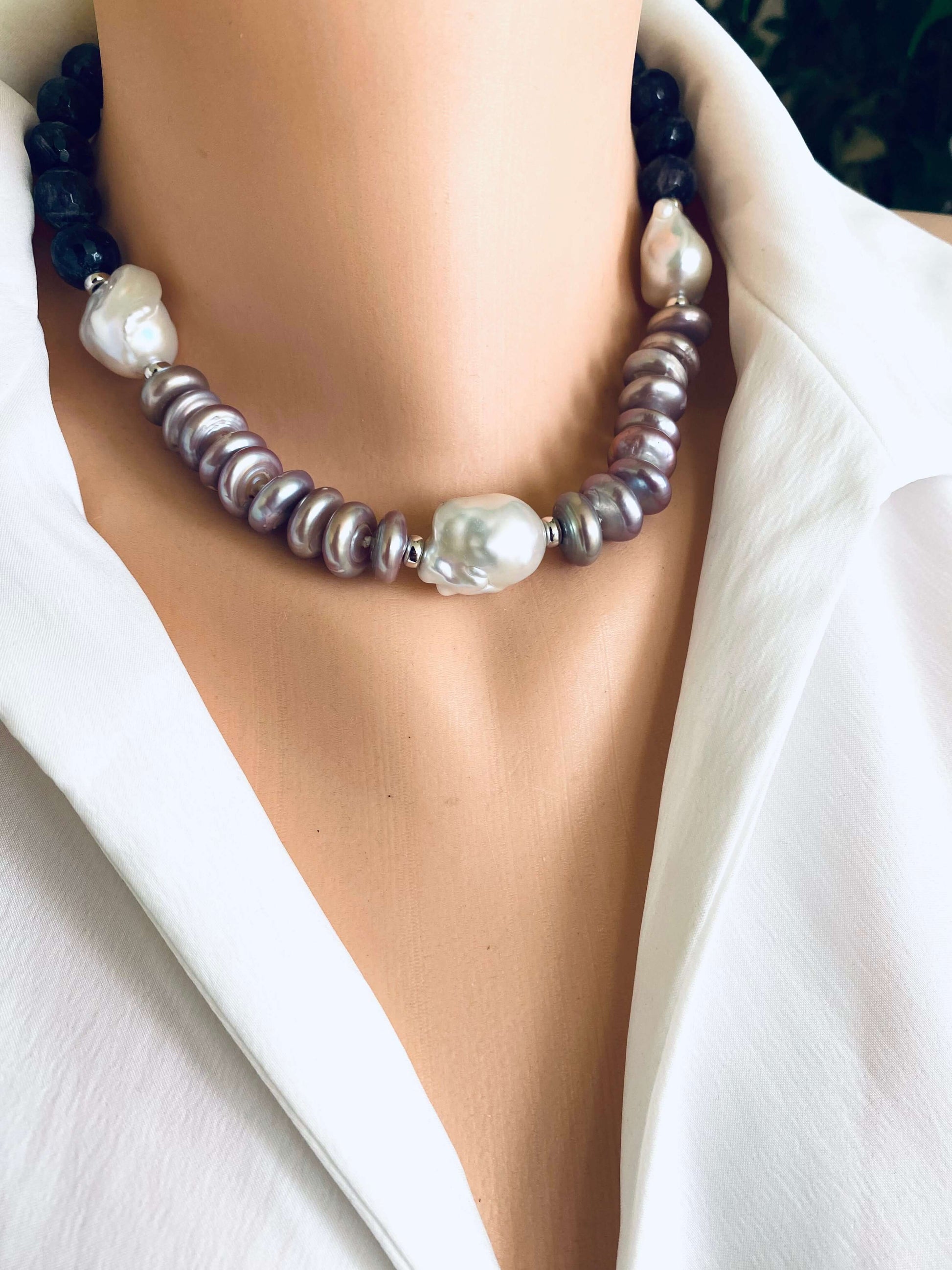 Amethyst pearl necklace featuring baroque and coin pearls, showcasing elegance and bold color in a refined design.