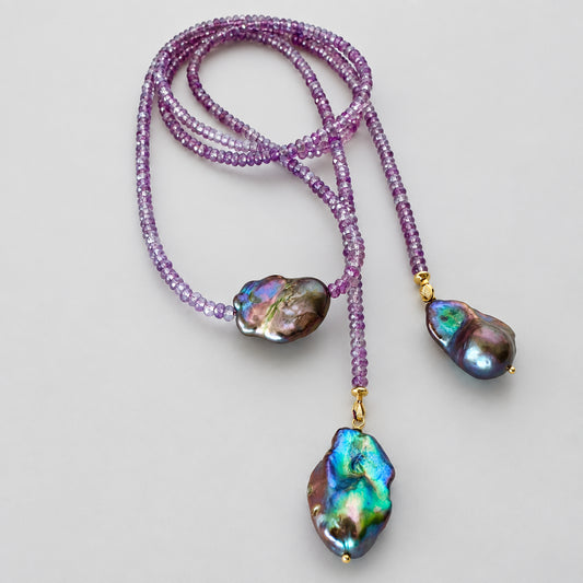 Close-up of Amethyst and Black Baroque Pearl Lariat Necklace on white background — faceted amethyst beads and baroque pearls handcrafted by Loulia Pearl Jewelry