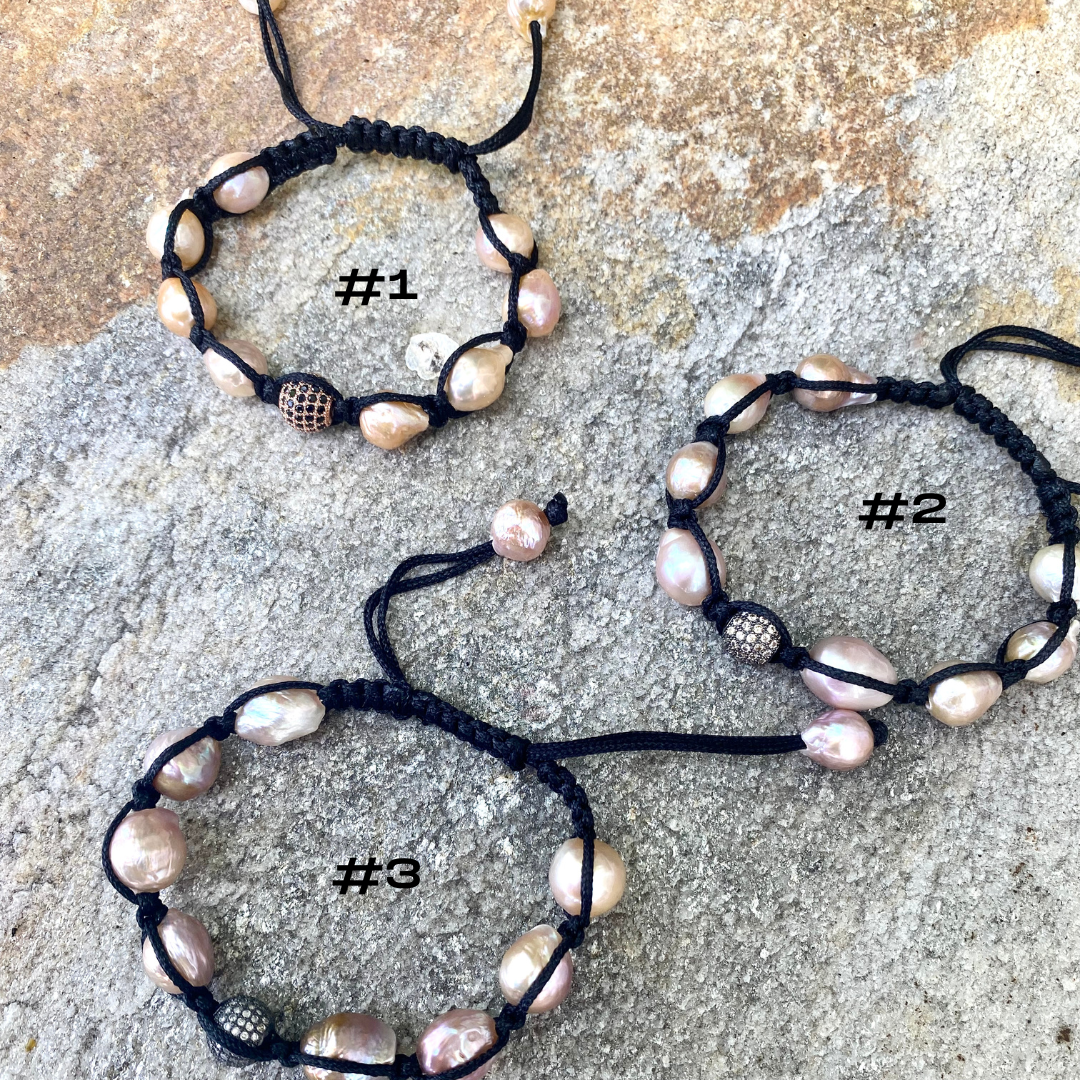 Baroque pearl bracelet featuring pastel pearls on black thread in three unique designs.