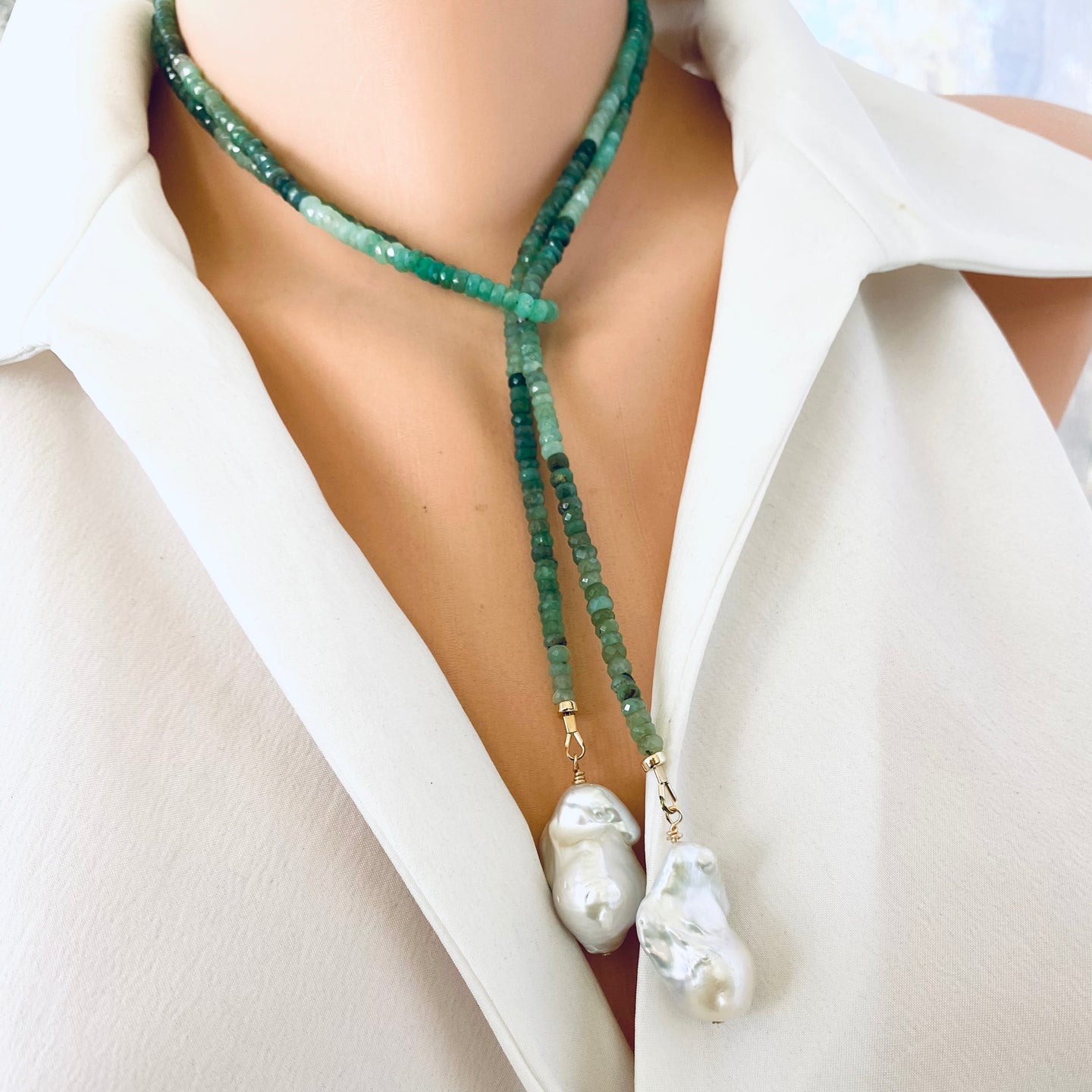 Single strand lariat wrap necklace featuring shaded green chrysoprase rondelle beads and two baroque pearls. The necklace is 42 inches long with gold-plated silver details, offering a versatile and elegant design for women.