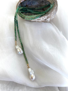 Single strand lariat wrap necklace featuring shaded green chrysoprase rondelle beads and two baroque pearls. The necklace is 42 inches long with gold-plated silver details, offering a versatile and elegant design for women.