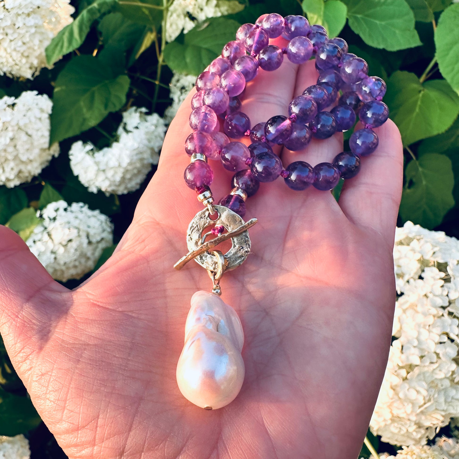 Amethyst toggle necklace with hand knotted purple beads and baroque pearl pendant