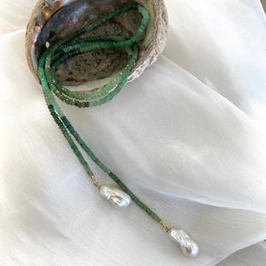 Single strand lariat wrap necklace featuring shaded green chrysoprase rondelle beads and two baroque pearls. The necklace is 42 inches long with gold-plated silver details, offering a versatile and elegant design for women.