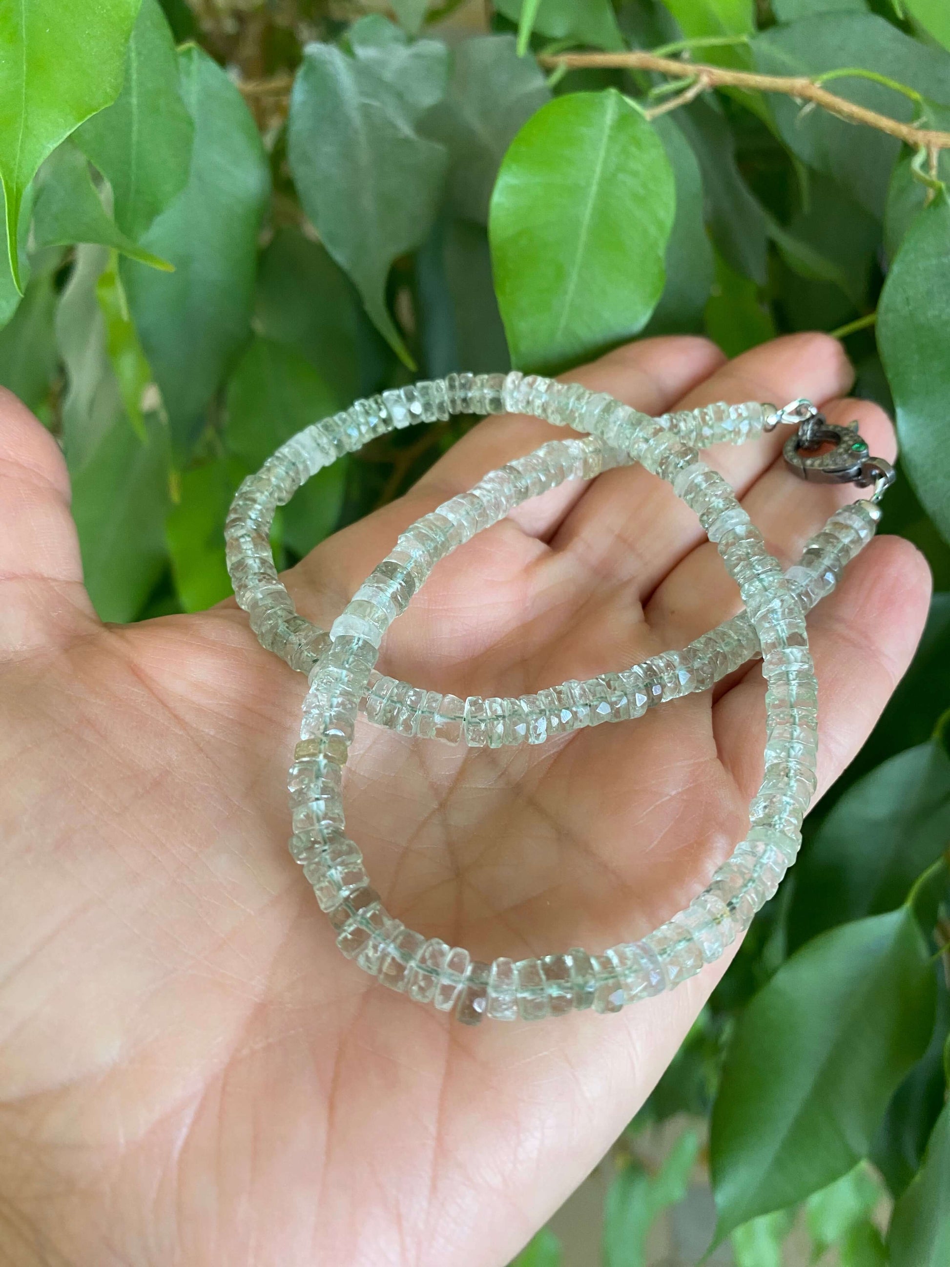Green amethyst beaded necklace with diamond & emerald pavé clasp, showcasing its elegant design and craftsmanship.